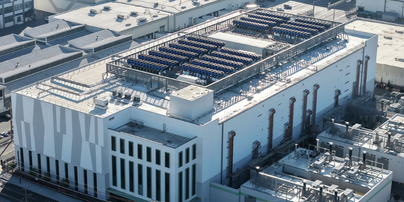 Web Banners - News Blogs 1 - The AG Center Aerial view of a large commercial building rooftop filled with rows of blue HVAC units and ventilation ducts.